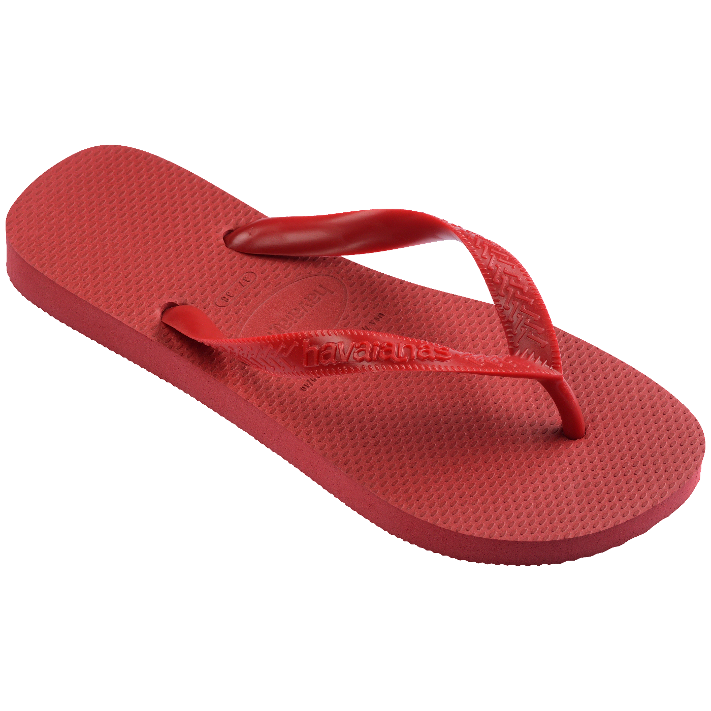 Chinelo Havaianas vermelho visto em perspectiva inclinada, mostrando o solado texturizado e as tiras vermelhas com acabamento brilhante sobre fundo branco.