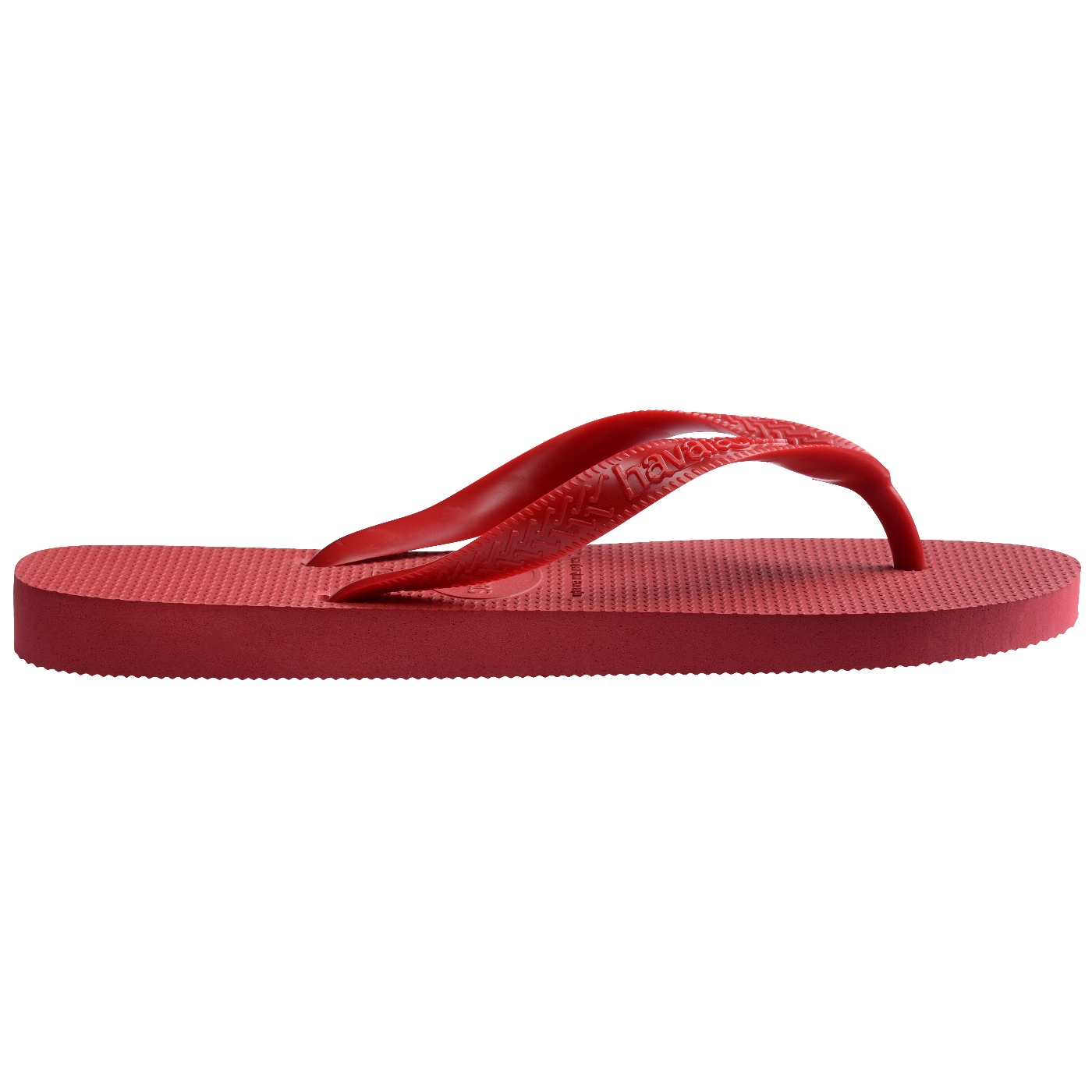 Chinelo Havaianas vermelho fotografado de lado, destacando a espessura do solado de borracha e as tiras vermelhas sobre fundo branco.