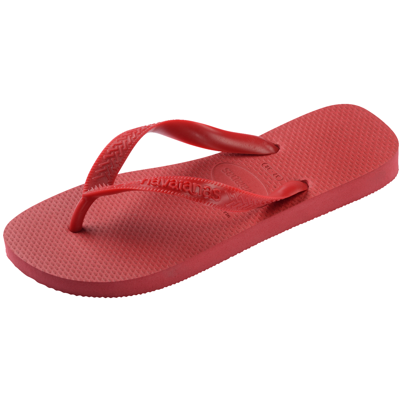 Chinelo Havaianas vermelho fotografado em perspectiva diagonal, com foco no solado texturizado de borracha e nas tiras vermelhas sobre fundo branco.